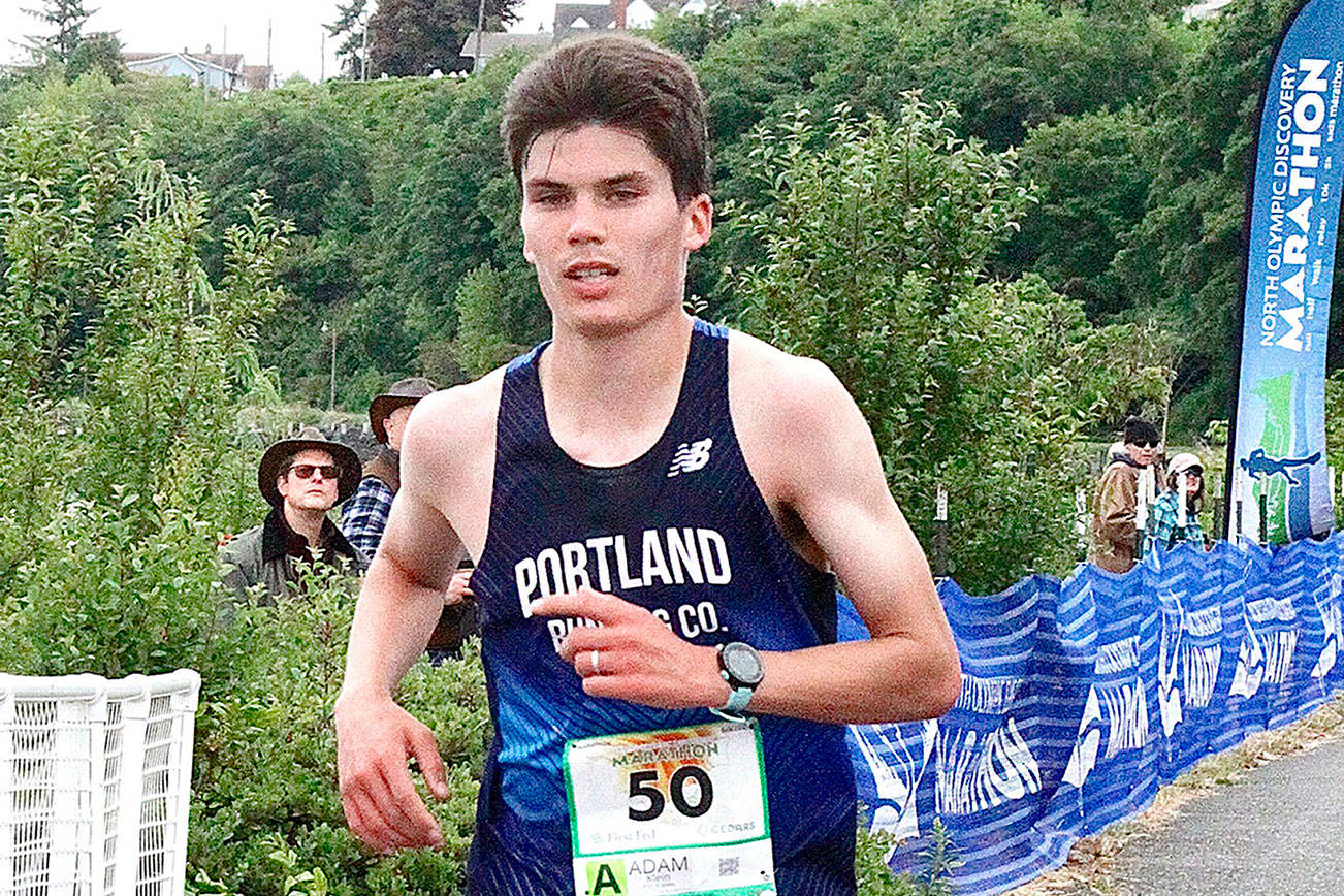 Adam Klein of Tualatin, Ore., wins the North Olympic Discovery Marathon on Sunday in 2 hours, 21 minutes, 18 seconds, nearly 14 minutes ahead of second place and 2 1/2 minutes short of a U.S. Olympic trial qualifier. (Dave Logan/for Peninsula Daily News)