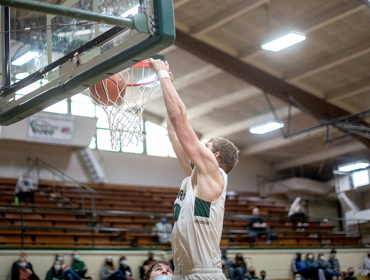 The Roughriders’ John Vaara dunks the ball for two of his 14 points against Central Kitsap on Monday in Port Angeles. The Riders won to qualify for the Olympic League championship game against defending state champion North Kitsap on Wednesday night. (Jesse Major/for Peninsula Daily News)