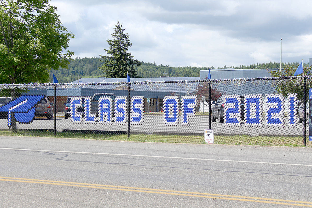 Chimacum School District has lined the fence outside of the school along Rhody Drive with banners honoring its 2021 graduating class. Public high schools across the North Olympic Peninsula are conducting their graduation ceremonies this weekend. (Zach Jablonski/Peninsula Daily News)
