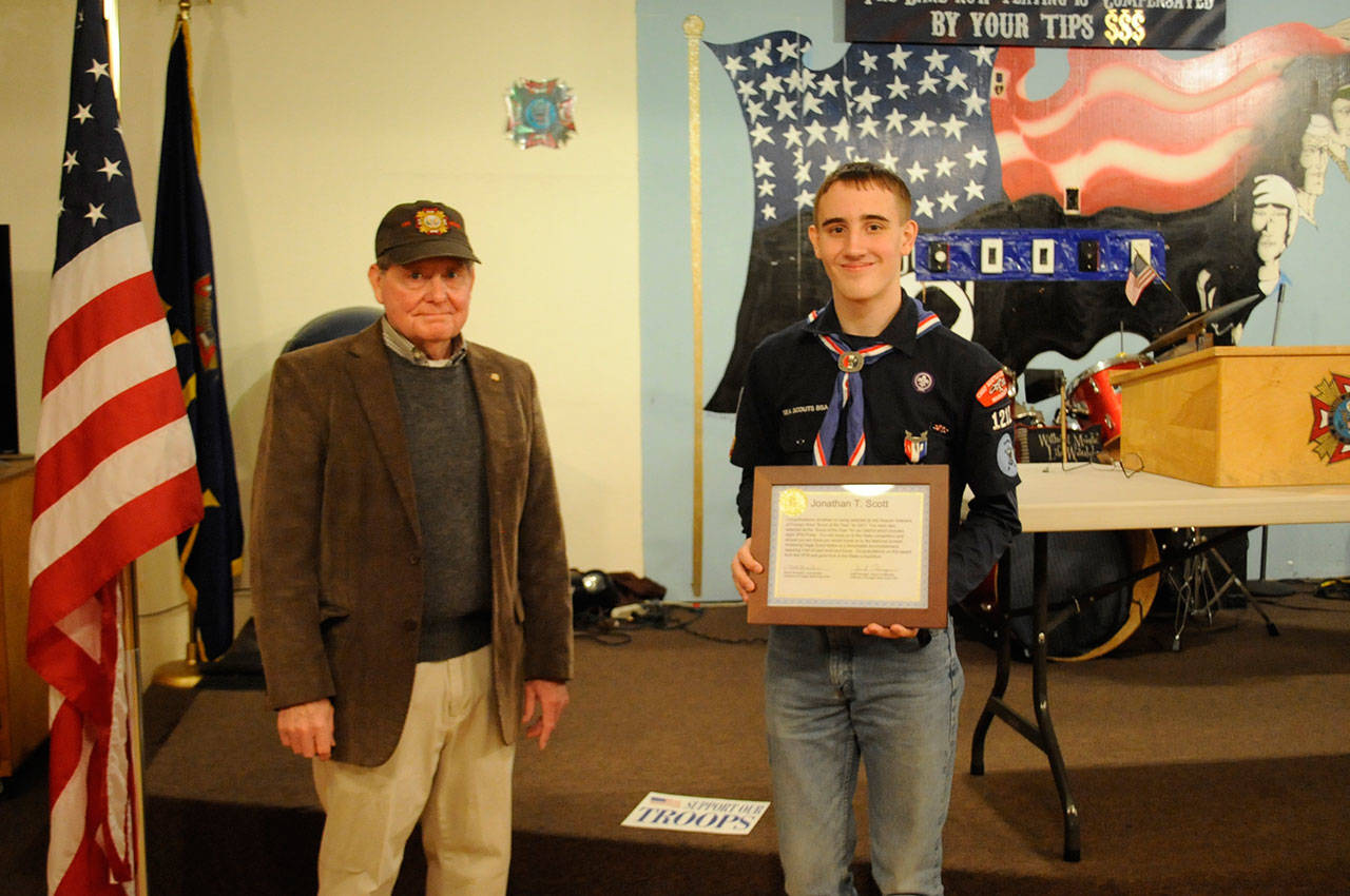 Jonathan Scott of Port Angeles received Sequim VFW Post 4760’s Scout of the Year award in April from Jack Flanagan. Scott also won the District 14 VFW, and now the Washington State award. His application will compete in the national contest to become the United States’ VFW Scout of the Year. (Matthew Nash/Olympic Peninsula News Group)