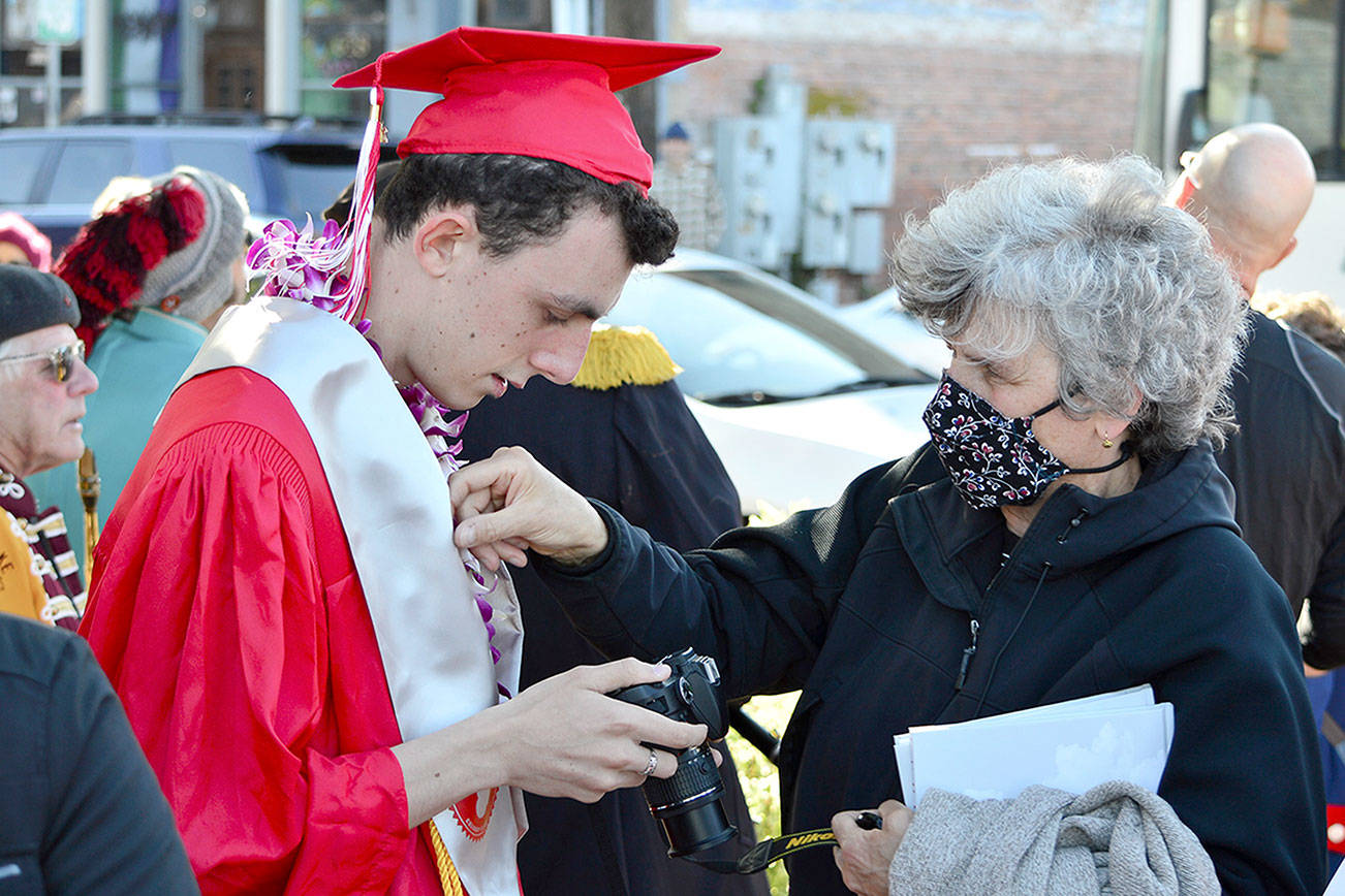 Diane Urbani de la Paz/Peninsula Daily News 

Nathalie Ballou sends her son Pierre Ballou, 19, off to graduate from Port Townsend High School on Friday night. Ceremonies for Chimacum and Quilcene high school graduating seniors were on Saturday. To view ceremonies online, see https://highschool.ptschools.org/ for Port Townsend, https://www.csd49.org/CJSHS/home for Chimacum and https://fb.me/e/1oyAmiWdA for Quilcene.
