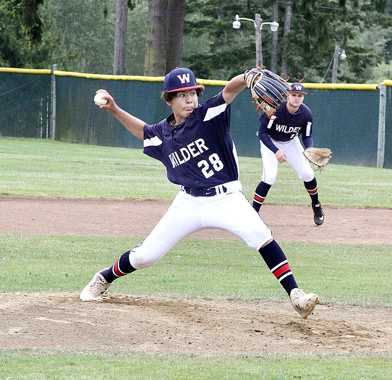 Payton Cagey pitches for Wilder Junior against Rock Creek on Sunday at Volunteer Field in Port Angeles. (Dave Logan/for Peninsula Daily News)