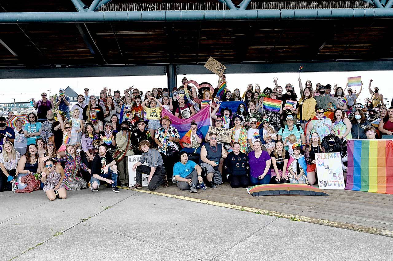 About 370 people gather Saturday at City Pier in Port Angeles for the inaugural Pride Celebration. Separate marches from the pier and the Clallam County Courthouse converged at Front and Lincoln streets led by Eli Smith and Ian Nickel. Earlier in the day, the Farmers Market celebrated pride month and SisterLand Farms gave out free plant starts to anyone who visited in their best pride-themed outfit. Food Not Bombs had a free pride-themed barbecue at Jesse Webster Tree Park, and the North Olympic Library System hosted an online event called Storytime with a Queen. The event organizers were Navarra Carr, Cloud Huxley, Jenson, Benji Astrachan, Smith and Nickel. (Photo courtesy of Kasia Kawczynski)