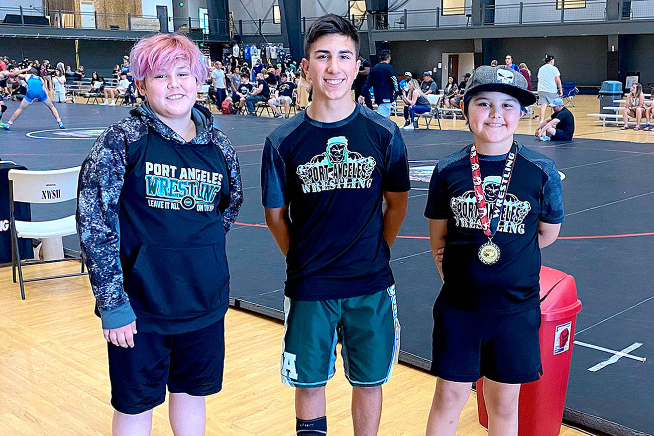 Courtesy photo
From left, Christian Snavely, Phoenix Flores and Chloe Snavely of Port Angeles wrestled at the Washington State Wrestling Association Kids Folkstyle state championships this past weekend in Centralia.