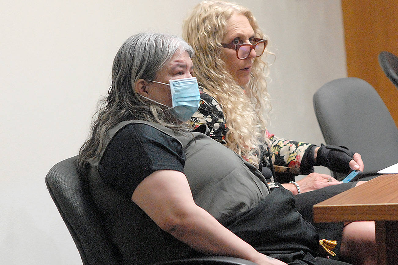 Larisa Jean Dietz, 50, of Sequim, front, sits with attorney Karen Unger in Clallam County Superior Court on Wednesday. Dietz is charged with first-degree assault and attempted second-degree murder in the Oct. 8, 2019, stabbing of a wheelchair-bound Sequim man she said had groped her. (Keith Thorpe/Peninsula Daily News)