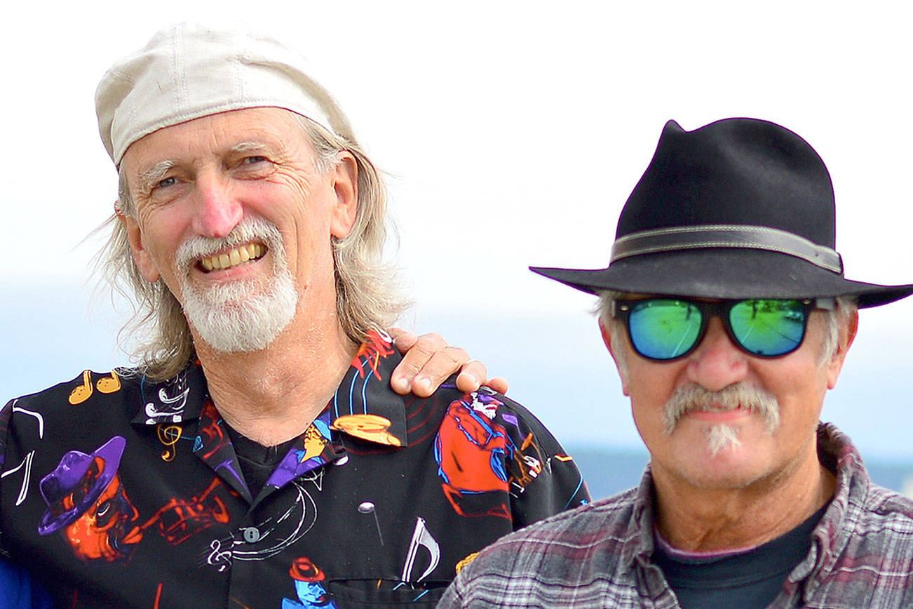 Multi-instrumentalist John Maxwell, left, and blues violinist Jon Parry will mix their music into the Red, White & the Blues event Sunday at the Old Alcohol Plant. (Diane Urbani de la Paz/Peninsula Daily News)