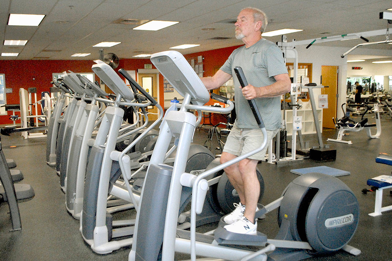 Keith Thorpe/Peninsula Daily News
Mike Schefers of Port Angeles works out at the Olympic Peninsula YMCA in Port Angeles.