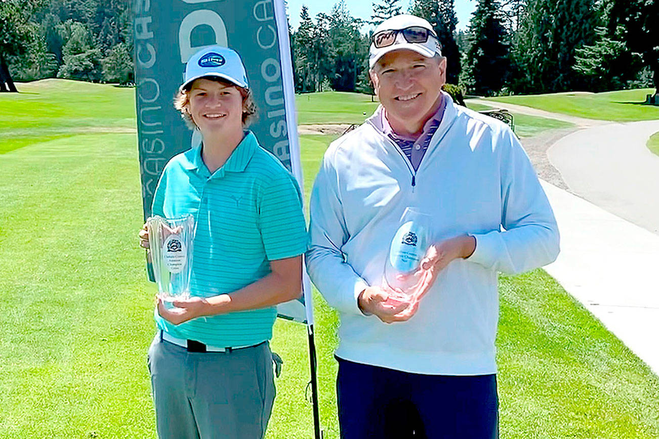 Cedars at Dungeness
Ben Sweet, left, and Jim McCausland receive their trophies for winning at the Clallam County Amateur Golf Tournament. Sweet, a Sequim High School golfer, won the trophy for the best three-day gross score of 224. McCausland, a member of the Cedars at Dungeness Men's Club, won the overall net championship with a score of 204. Sweet and McCausland each won $375 cash purses.