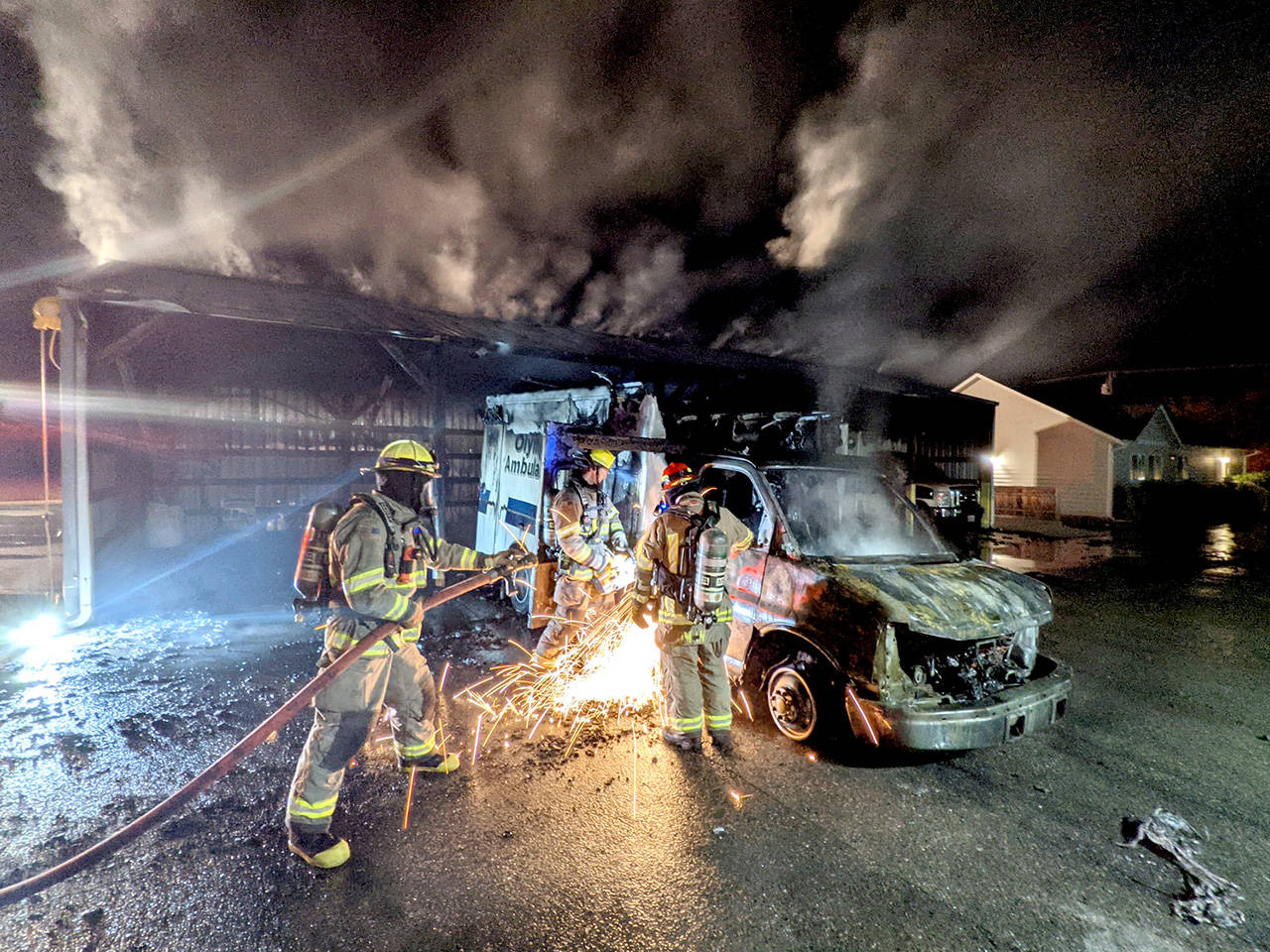 Firefighters respond to an early morning fire at Olympic Ambulance early Tuesday. (Clallam County Fire District 3)