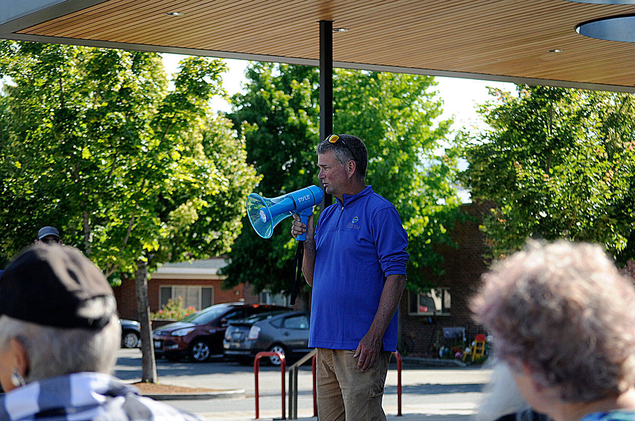 Gary Butler with Sequim’s parks department thanks fellow staffers for their efforts and leadership in recent months during a rally last week in front of the Sequim Civic Center. (Matthew Nash/Olympic Peninsula News Group)