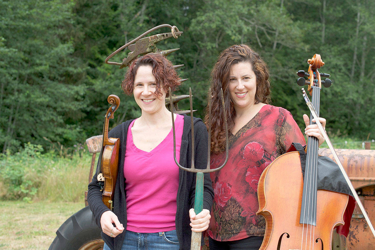 On a farm in Quilcene, the free Concerts in the Barn series will present classical music performances this summer, including Seattle Symphony violinist Elisa Barston, left, and her sister Amy Sue Barston, a cellist, on July 31 and Aug. 1. With pianist Jessica Choe joining them, the Barstons will become Trio Hava, performing music of Lily Boulanger, Ludvig van Beethoven and Johannes Brahms. (photo courtesy Concerts in the Barn)