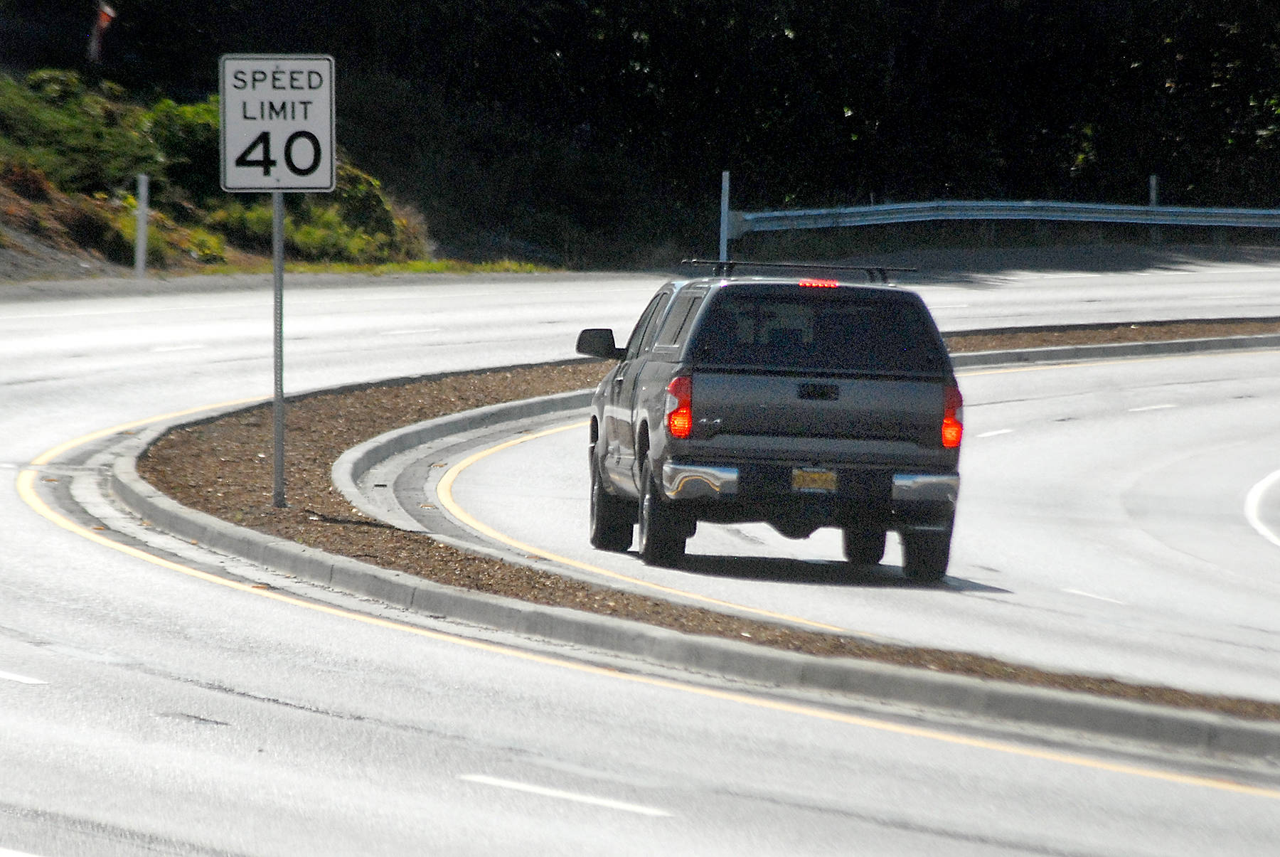 Keith Thorpe/Peninsula Daily News
A truck makes its way around a curve on a newly-divided section of U.S. Highway 101 on Saturday as the road descends into Morse Creek Valley east of Port Angeles.