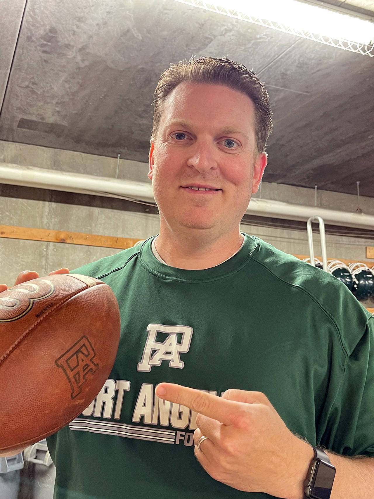 Dustin Clark, a Port Angeles boys basketball assistant and a two-time state champion back at Elma High School, has been selected to coach the Roughrider football team.