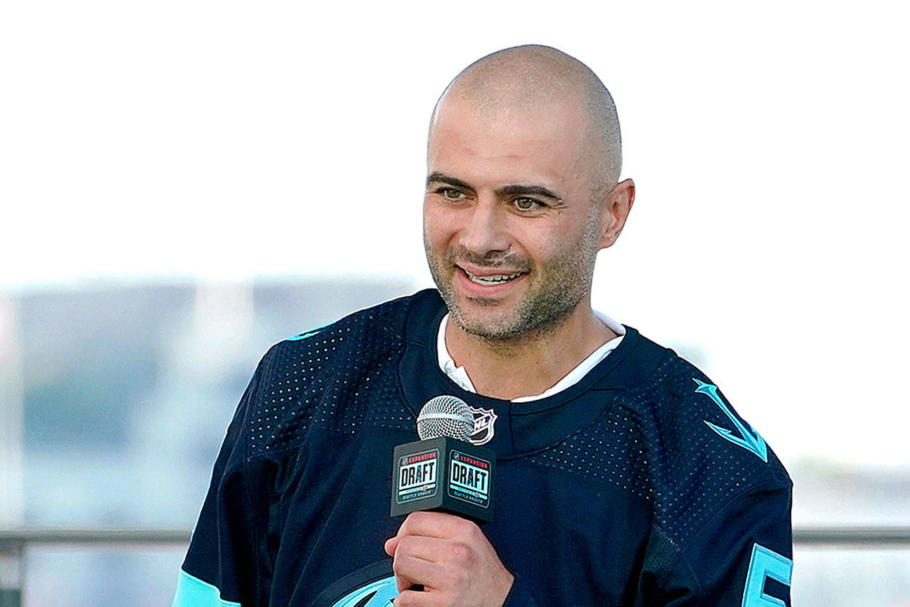 Mark Giordano, a defender from the Calgary Flames, speaks Wednesday, July 21, 2021, after being introduced as a new Seattle Kraken player during the Kraken's NHL hockey expansion draft event in Seattle. (AP Photo/Ted S. Warren)