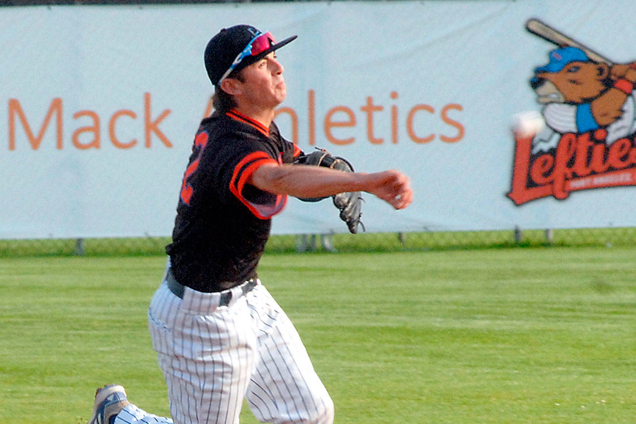 Keith Thorpe/Peninsula Daily News
Lefties shortstop Nick Oakley makes a throw to first on Thuirsday night in Port Angeles.