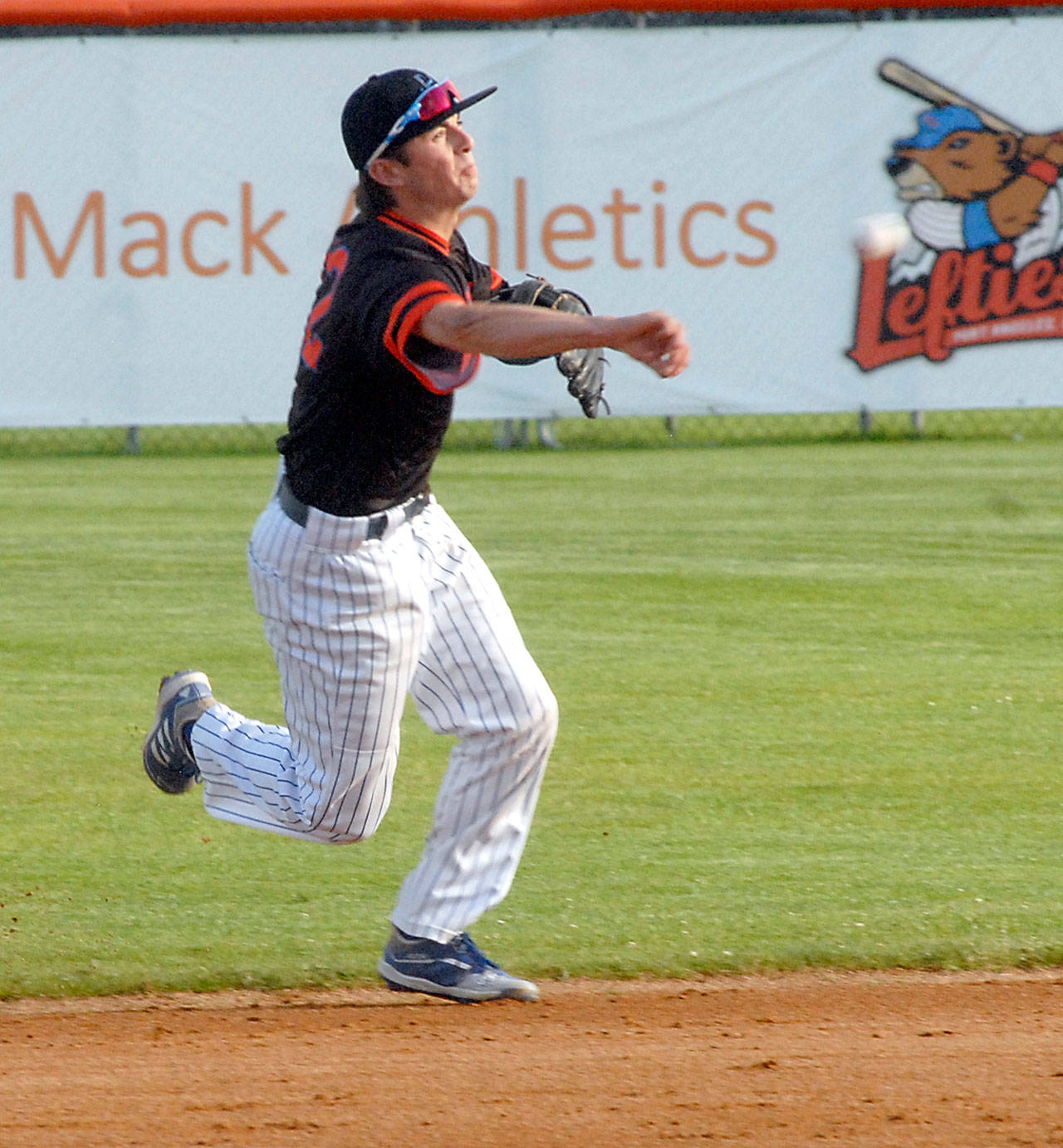 Port Angeles Lefties shortstop Nick Oakley makes a throw to first on during a game at Civic Field in Port Angeles. (Keith Thorpe/Peninsula Daily News)