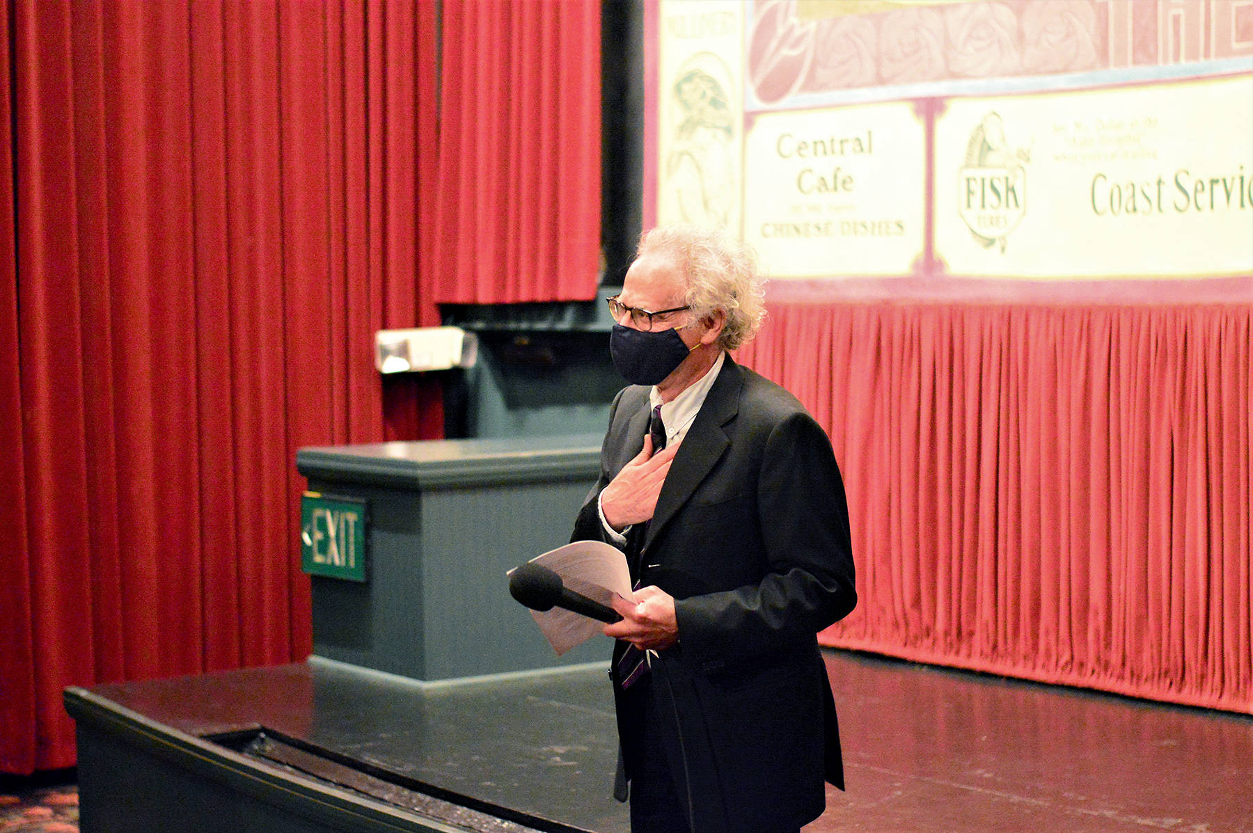 Receiving a standing ovation from the audience at the Rose Theatre on Wednesday night, owner Rocky Friedman expressed his gratitude to supporters who waited 499 days for the downtown Port Townsend cinema to reopen. Friedman also introduced his mother Miriam, 101, during his speech before the showing of the film “The Truffle Hunters,” from Italy. The two-screen movie house is using a MERV-13 air filtration system and selling two-thirds of the seats for each screening. Diane Urbani de la Paz/Peninsula Daily News