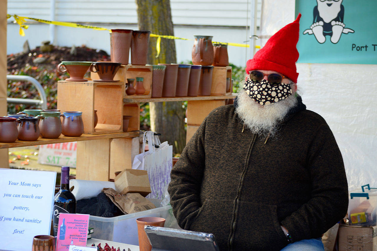 Darby Huffman of LaughinGnome Pottery, pictured at the Port Townsend Farmers Market, will welcome visitors to the new studio space he shares with partner Francie Loveall this Friday evening during the First Friday Speaker Series program. (Diane Urbani de la Paz/Peninsula Daily News)