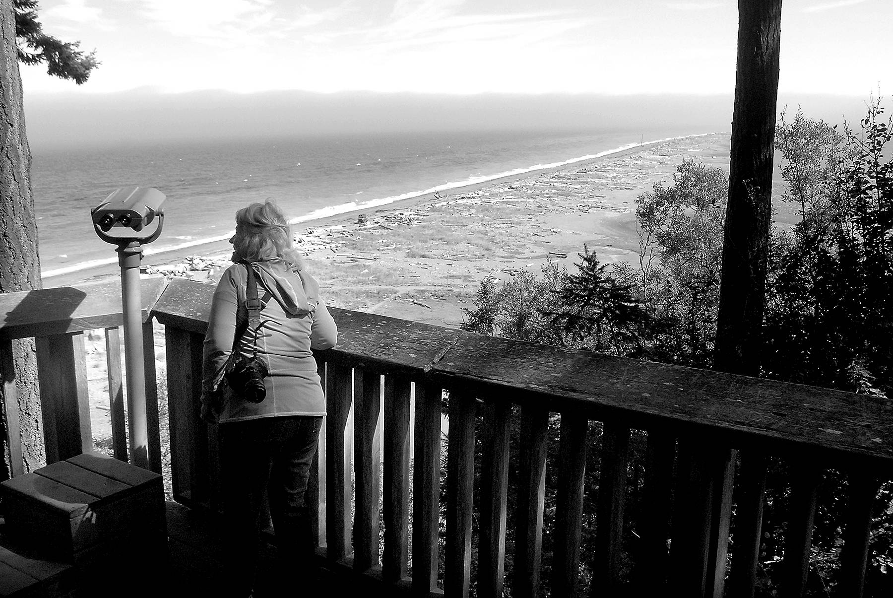 Keith Thorpe/Peninsula Daily News
Phyllis Millan of Wilsonville, Ore., admires the view on Dungeness Spit on Thursday from an overlook in the Dungeness National Wildlife Refuge north of Sequim. The refuge, home to a variety of birds and marine mammals, offers the access trail to hikers along the spit.