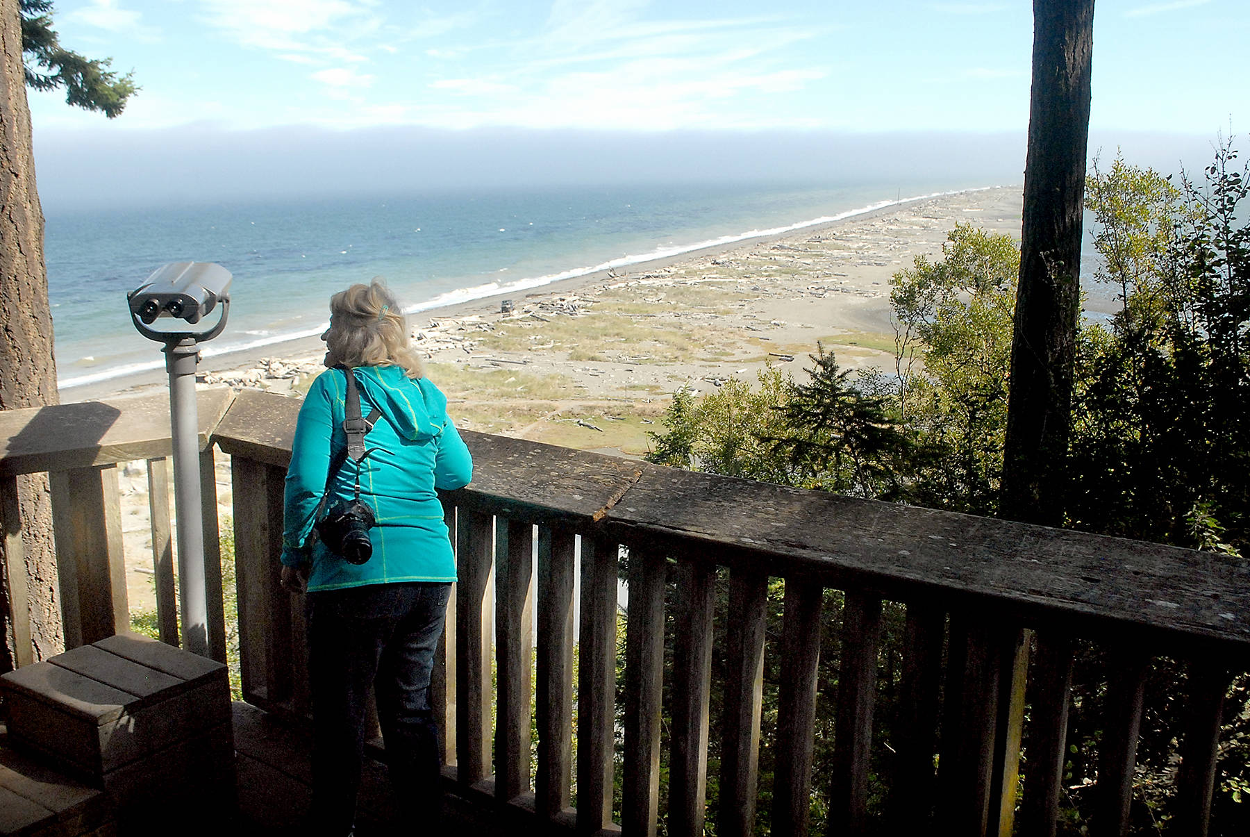 Keith Thorpe/Peninsula Daily News
Phyllis Millan of Wilsonville, Ore., admires the view on Dungeness Spit on Thursday from an overlook in the Dungeness National Wildlife Refuge north of Sequim. The refuge, home to a variety of birds and marine mammals, offers the access trail to hikers along the spit.