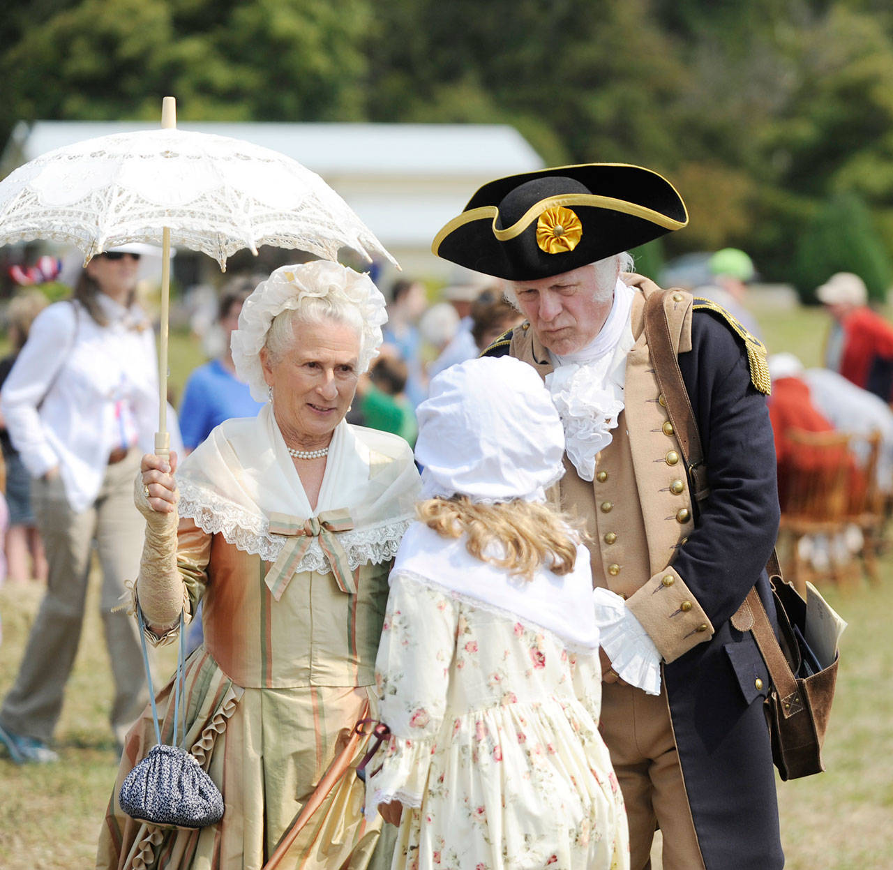 Martha Washington (Jane Ritchey) and George Washington (Vern Frykholm Jr.) meet with a young visitor at the Northwest Colonial Festival in 2019. The pair return this year from Thursday through Sunday for daily visits with guests. (Michael Dashiell/Olympic Peninsula News Group)
