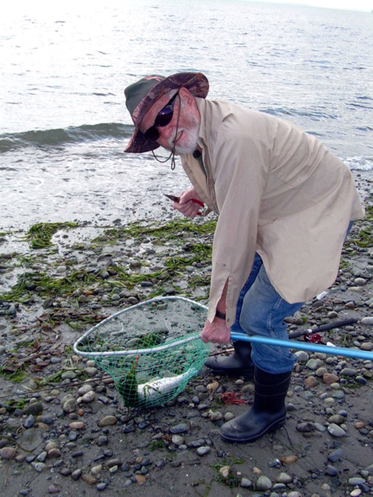 Quilcene angler Ward Norden found beach casting success from the shore of Fort Flagler State Park recently, catching this pink with a pink rotator jig. Pinks are at the height of their odd-year return this month. (Photo courtesy of Holly Bauman)