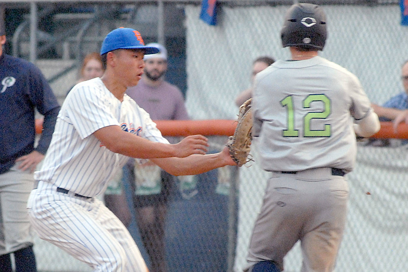 Keith Thorpe/Peninsula Daily News
Lefties first baseman Nathan Chong, left, tags out Portland's Gabe Skoro before he can reach first in the third inning on Tuesday at Port Angeles Civic Field.