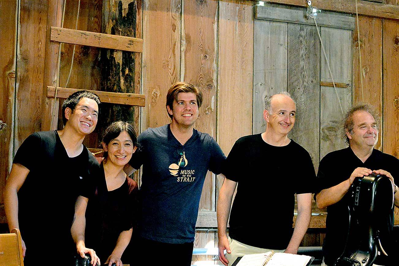 Following the Takács Quartet’s performance Sunday in the barn at Trillium Woods Farm, Music on the Strait co-artistic directors Richard O’Neill, far left, and James Garlick, center, take a breather. With them are quartet violinists Harumi Rhodes and Edward Dusinberre and cellist András Fejér. (Diane Urbani de la Paz/Peninsula Daily News)