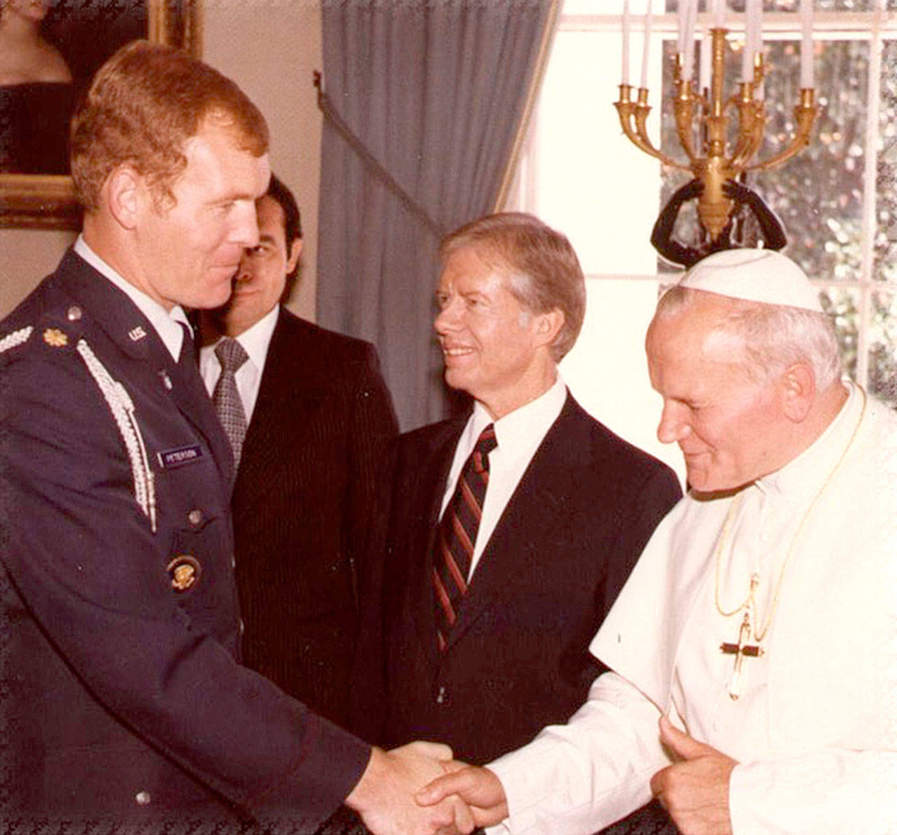 Port Angeles graduate Bob Peterson, left, meets with Pope John Paul II while President Jimmy Carter looks on. Peterson was a U.S. Air Force aide to Carter in the late 1970s.