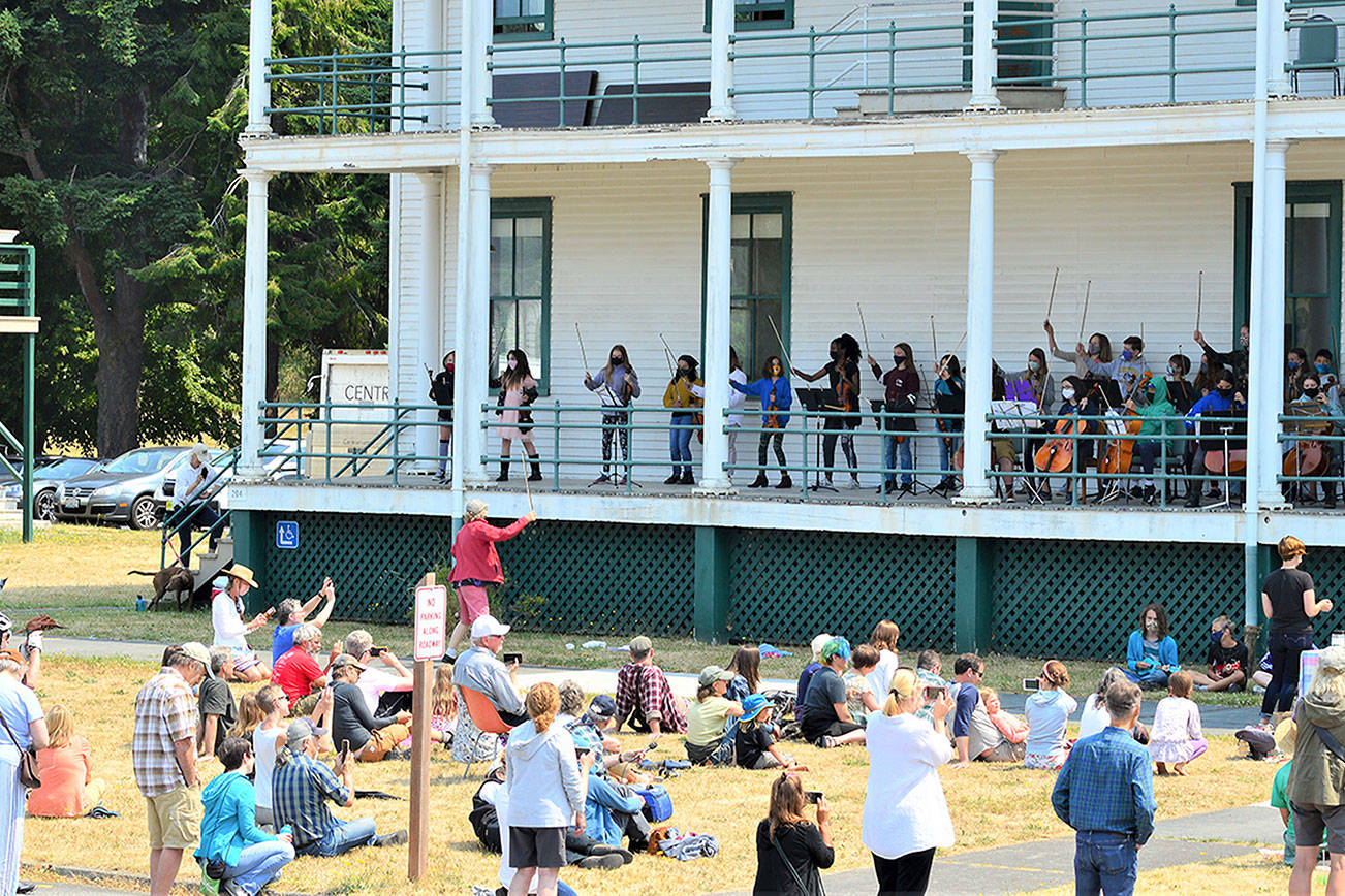 Performer and teacher Kristin Smith, standing on the grass, is among the faculty members hosting a free concert by the YEA Music students this Friday at Fort Worden State Park. (Diane Urbani de la Paz/Peninsula Daily News)