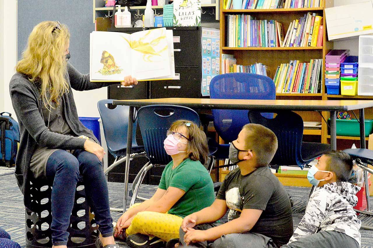Chimacum Elementary summer school teacher Michelle Moseley reads “What Do You Do with a Chance?” to her students Tuesday morning. (Diane Urbani de la Paz/Peninsula Daily News)