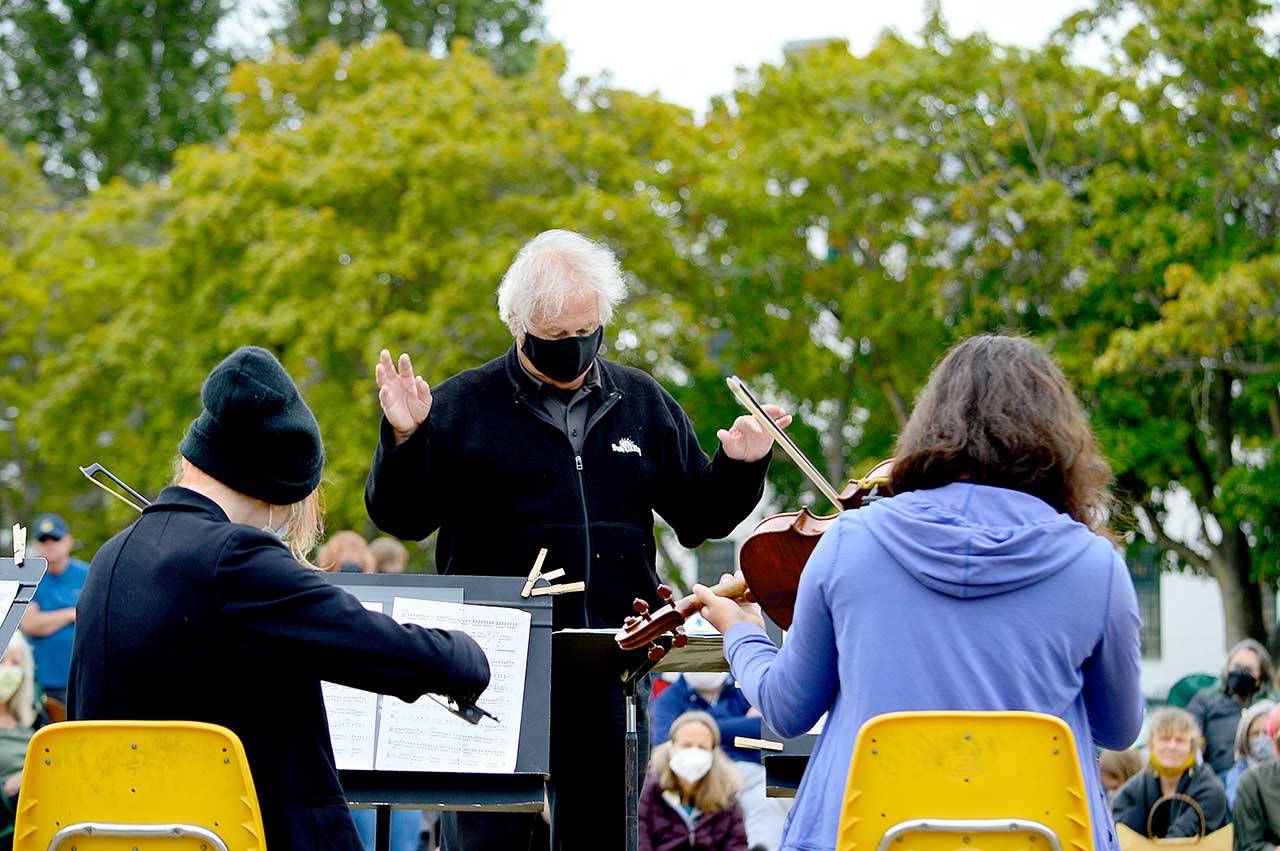 Retired Port Angeles High School orchestra director Ron Jones leads a chamber ensemble during Friday’s YEA Music! Camp finale concert at Fort Worden State Park. (Diane Urbani de la Paz/Peninsula Daily News)