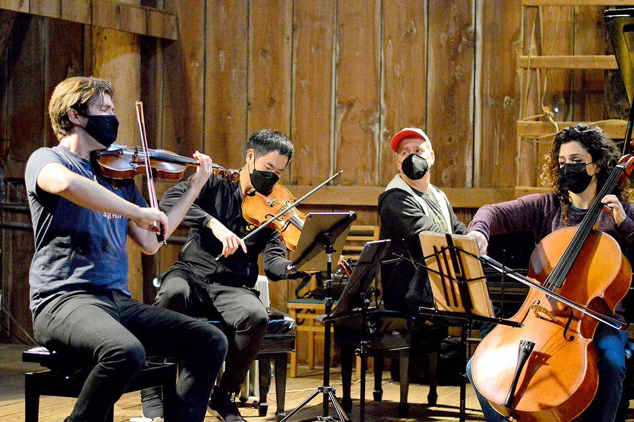 The barn at Trillium Woods Farm near Quilcene is the setting for free chamber concerts this summer, including last Sundays performance by, from left, James Garlick, Richard ONeill, Jeremy Denk and Ani Aznavoorian. This weekend will bring the final Concerts in the Barn at 2 p.m. Saturday and Sunday. Patrons who sit inside the barn must show proof of vaccination. (Diane Urbani de la Paz/Peninsula Daily News)