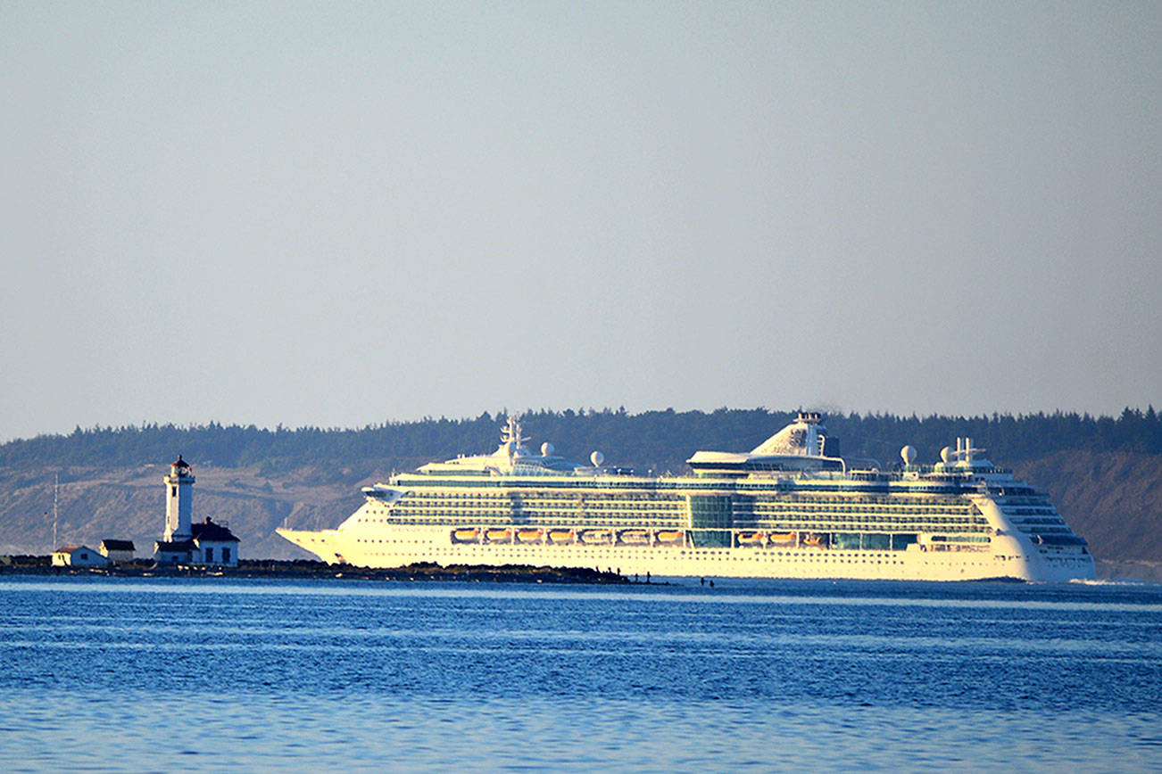 The 961-foot Serenade of the Seas skirts Point Wilson on its way from Seattle to Alaska. The Royal Caribbean ship, which holds 2,578 passengers, also passed Port Angeles and Sekiu en route to its first stop in Sitka today. (Diane Urbani de la Paz/Peninsula Daily News)