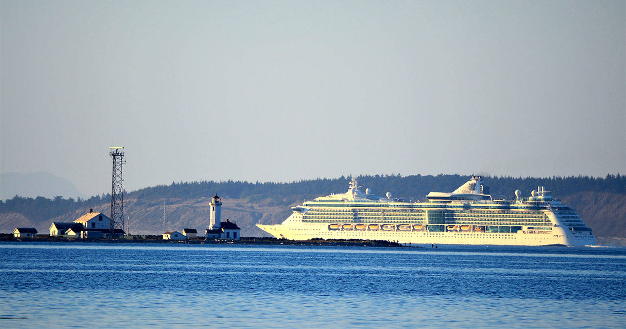 The 961-foot Serenade of the Seas skirts Point Wilson on its way from Seattle to Alaska. The Royal Caribbean ship, which holds 2,578 passengers, also passed Port Angeles and Sekiu en route to its first stop in Sitka today. (Diane Urbani de la Paz/Peninsula Daily News)