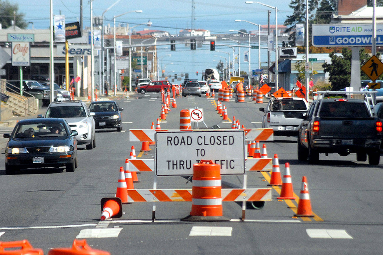 Keith Thorpe./Peninsula Daily News
Traffic makes its way through a gauntlet of orange cones and barrels on Tuesday as part of a safety enhancement prioject on South Lincoln Street in Port Angeles. The state-funded project is intended to improve pedestrian and bicycle safety along the half-mile corridor between East First and Eighth streets. It includes upgraded pedestrian crossings and installation of a new traffic light at Third Street. The project is expected to be completed by the end of the year.