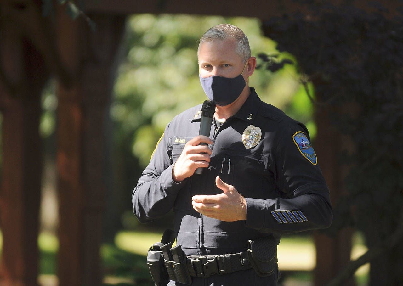 Sgt. Mike Hill of the Sequim Police Department thanks fellow essential workers at the Sequim-Dungeness Valley Chamber of Commerce’s annual picnic and Citizen of the Year presentation. The chamber honored essential workers with its 2020 award. (Michael Dashiell/Olympic Peninsula News Group)