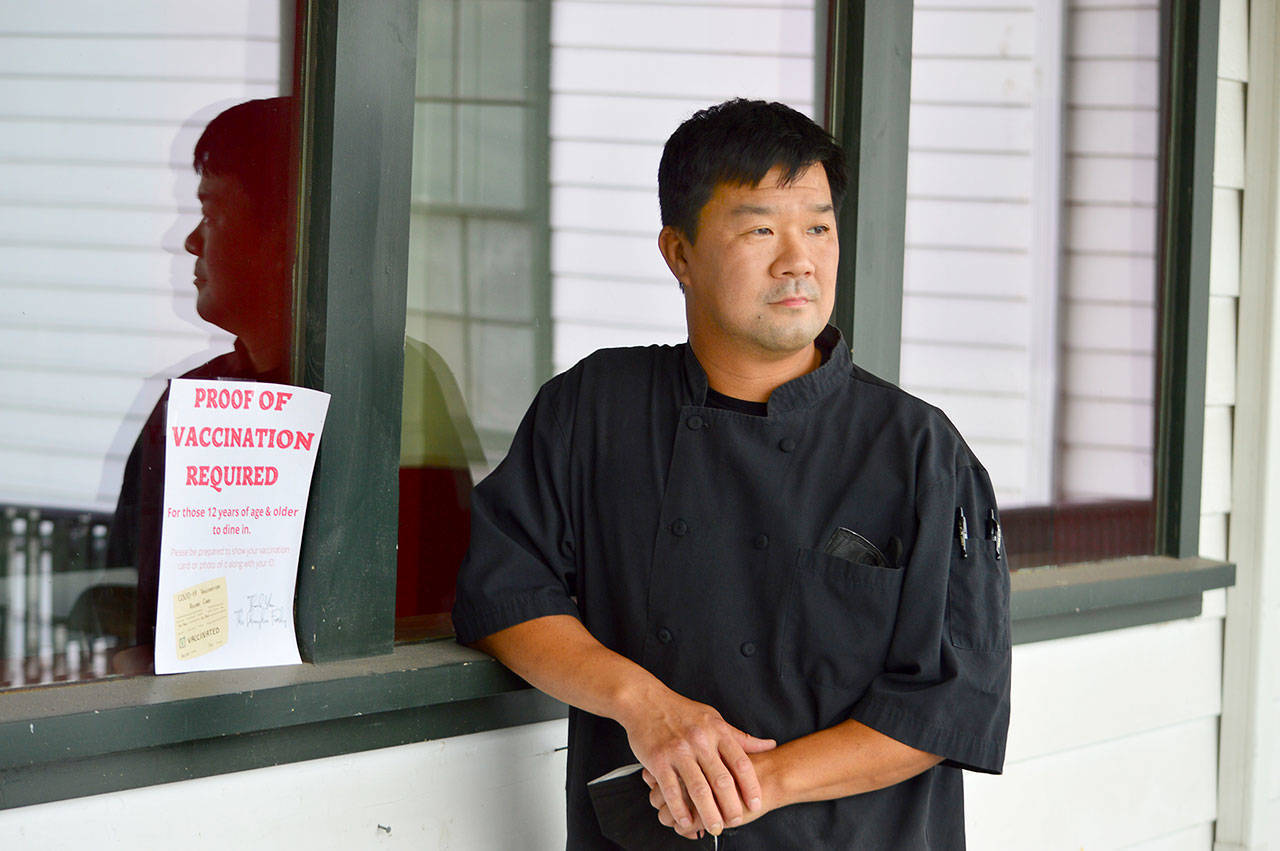 Shanghai Chinese Restaurant co-owner Jason Luong recently adopted a policy of checking the vaccination status of his customers. (Diane Urbani de la Paz/Peninsula Daily News)