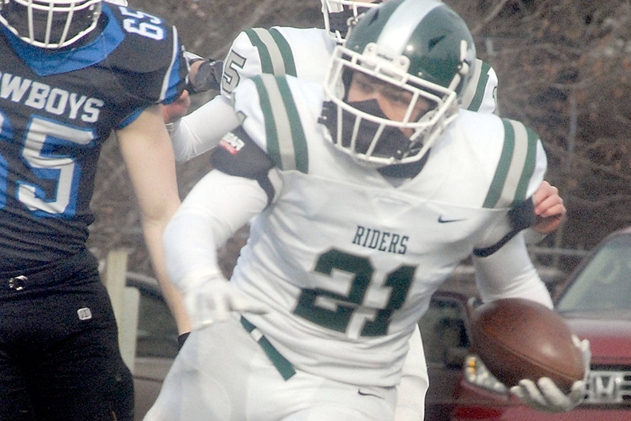 Keith Thorpe/Peninsula Daily News
Port Angeles' Daniel Cable runs outside during a February 2021 contest against East Jefferson. Cable, a senior, is expected to see plenty of carries for the Roughriders this fall.