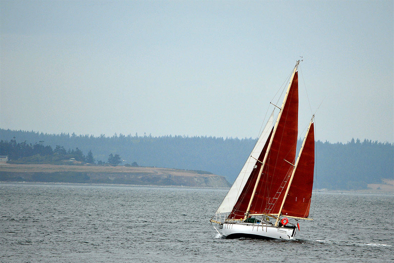 The Windsong sailboat of Port Townsend departs Friday morning from Point Hudson, where the Wooden Boat Festival would have taken place. The Sept. 10-12 festival is among two Port Townsend festivals canceled due to the changing COVID landscape, organizers said Friday. (Diane Urbani de la Paz/Peninsula Daily News)