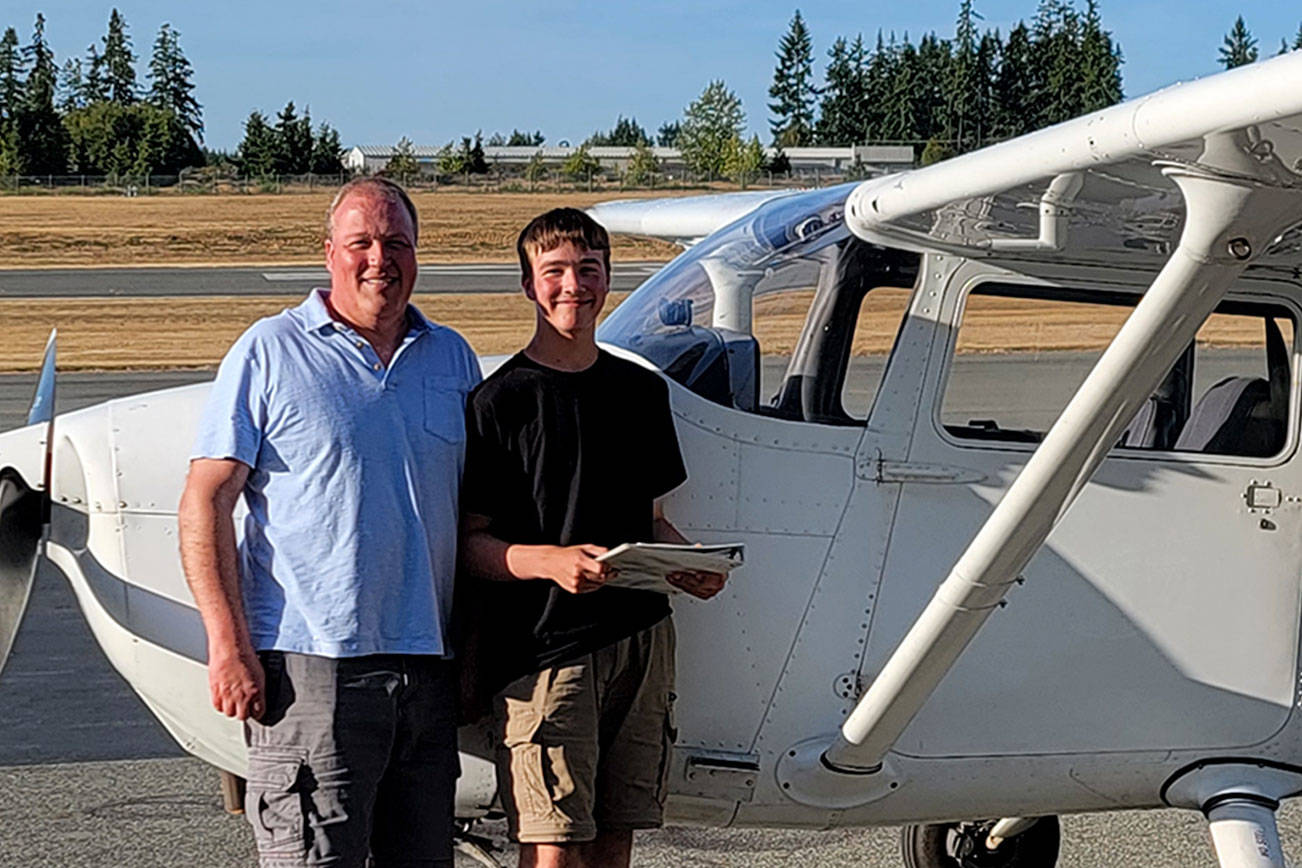 Cadet Kade Kirsch, pictured here with his father Matt Kirsch, completed his first powered solo flight on Aug. 10.