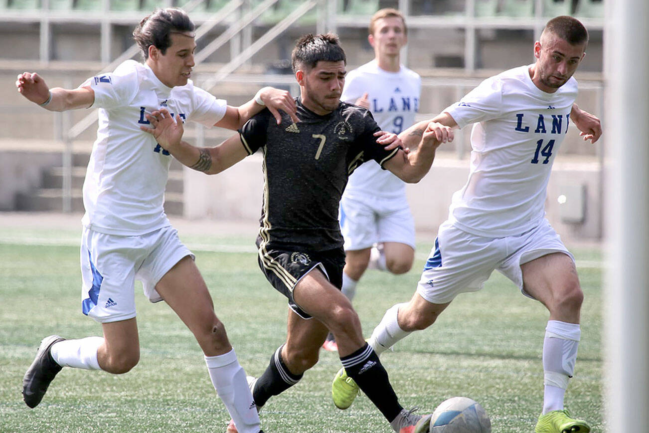 Peninsula's Jonathon De Motta, center, dribbles between two Lane defenders during the Pirates' 2-0 season-opening win last week. The Pirate men host Wenatchee Valley at 4 p.m. Sunday in their home opener. Peninsula's women host a free scrimmage tonight at 7 p.m. (Rick Ross/Peninsula College Athletics)