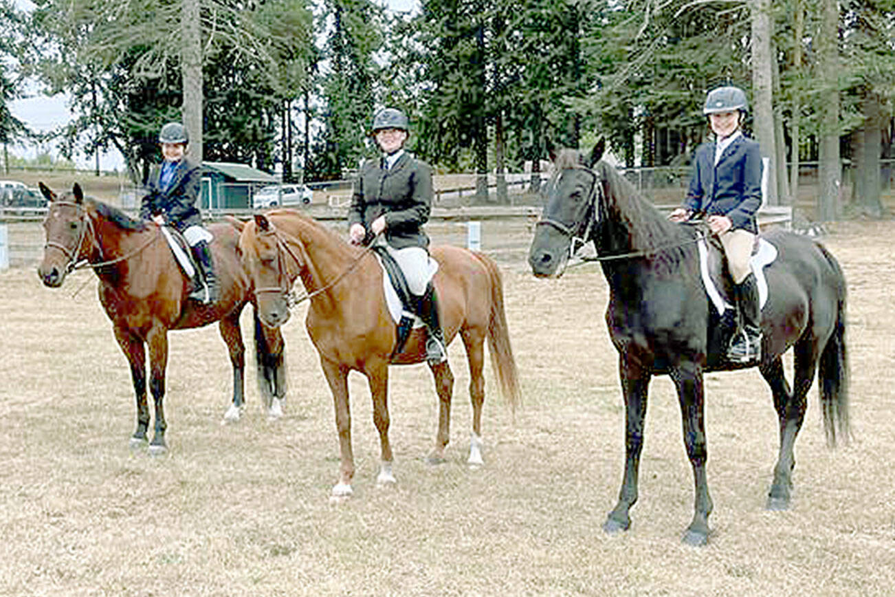 Photo by Katie Newton

Cutline: Ready for the Hunt seat class at the 4-H horse show at the Clallam County Fairgrounds are Lela Bankson, left, on Banjo, KK Pitts on Mikey and Lila Torey on Smokey.