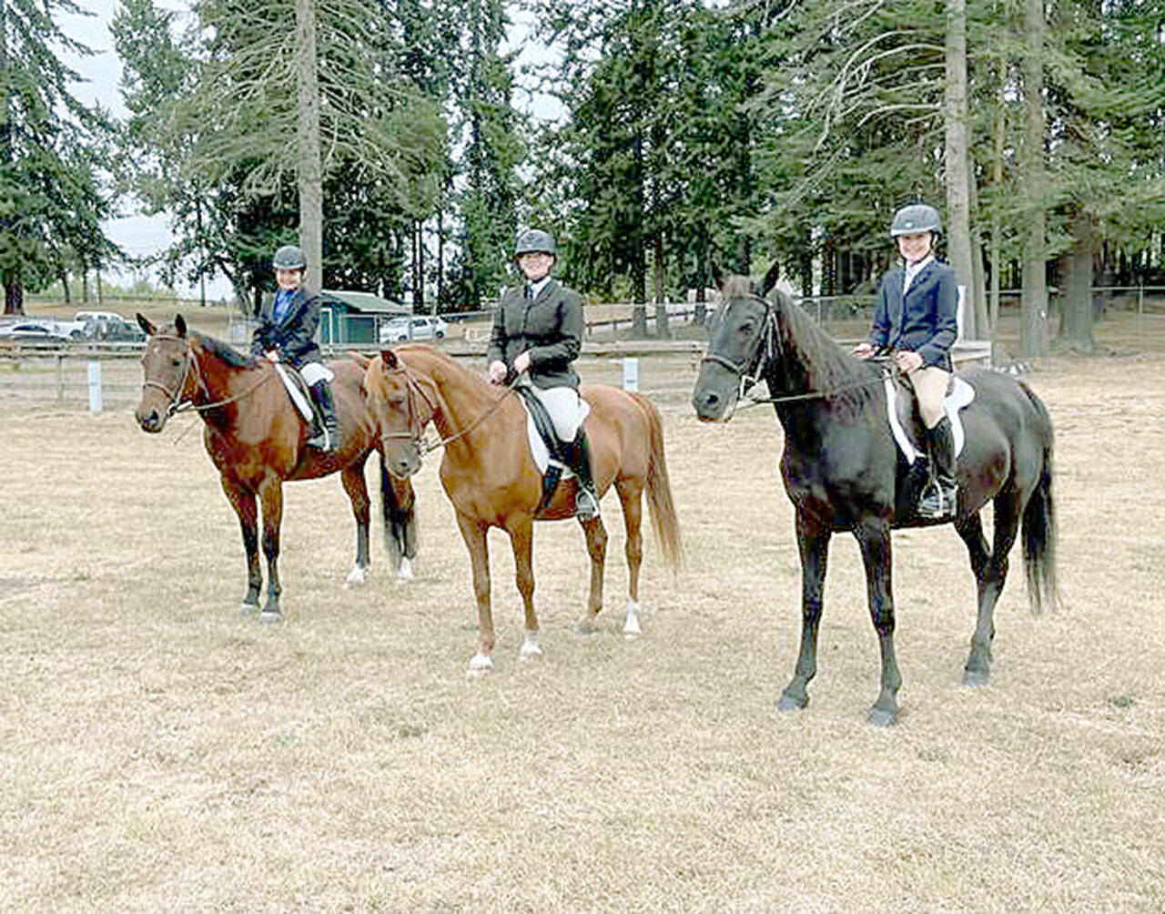 Lela Bankson, left, on Banjo, KK Pitts on Mikey and Lila Torey on Smokey are ready for the Hunt Seat class at the 4-H Horse Show at the Clallam County Fairgrounds. (Photo courtesy Katie Newton)
