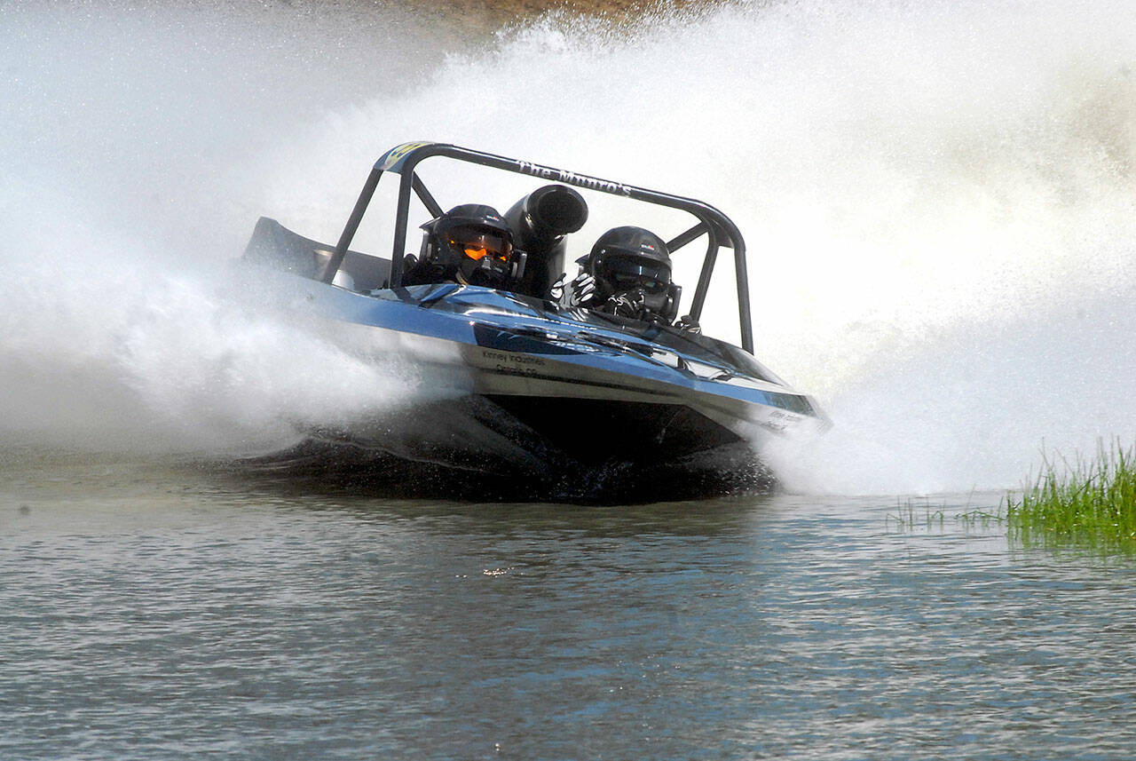 Team Kiwi, driven by Chris Munro and navigated by Katie Munro, competes at the Extreme Sports Park in Port Angeles. The team won the Unlimited Class at Julys first sprint boat race of the summer. (Keith Thorpe/Peninsula Daily News)