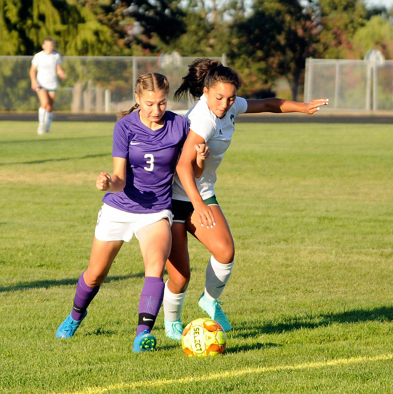 Michael Dashiell/Olympic Peninsula News Group Sequim’s Taryn Johnson, left, and Port Angeles’ Piper Williams vie for possession during the Roughriders 3-1 win on Thursday.