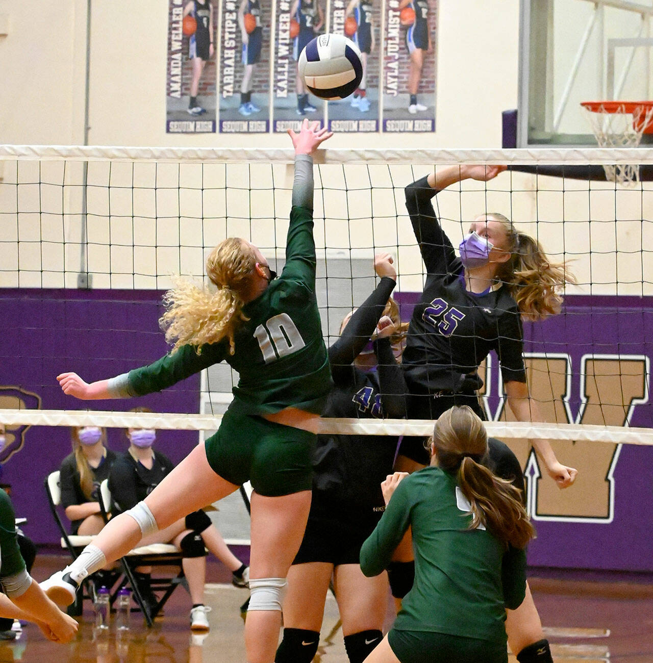Sequim’s Jolene Vaara, right, and Port Angeles’ Kennedy Bruch battle at the net during the Wolves’ 3-1 win over the Roughriders on Thursday. (Michael Dashiell/Olympic Peninsula News Group)