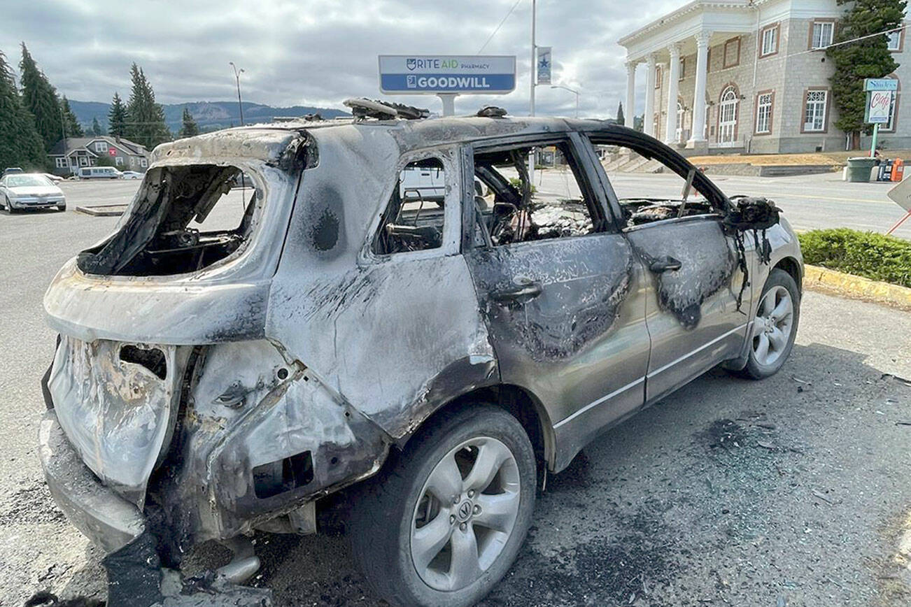 Paul Gottlieb/Peninsula Daily News
Authorities said an SUV was torched early Friday morning in the Goodwill Industries parking lot in Port Angeles.