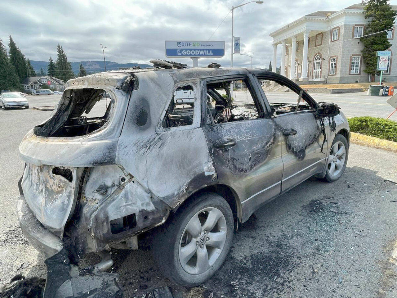 Authorities said an SUV was torched early Friday morning in the Goodwill Industries parking lot in Port Angeles. (Paul Gottlieb/Peninsula Daily News)