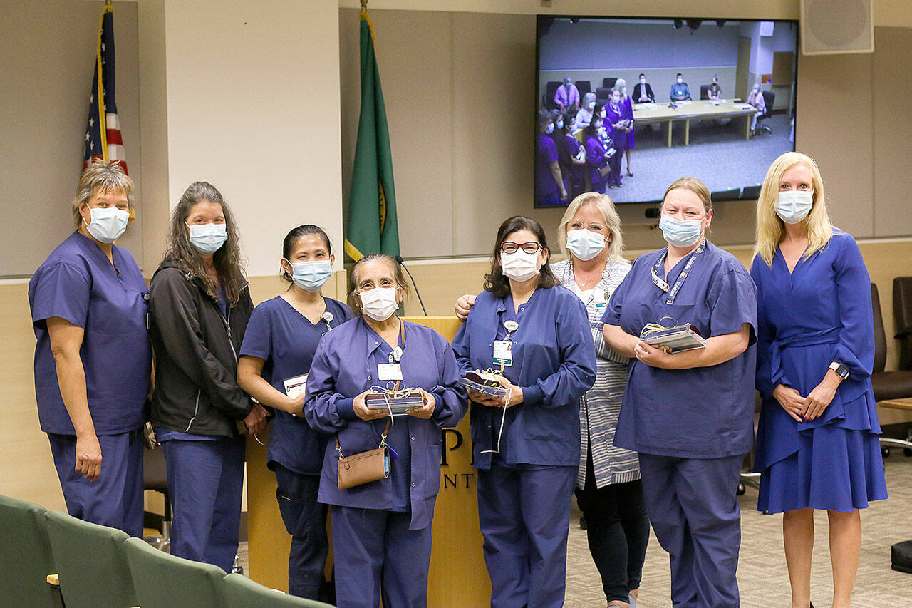 Olympic Medical Center recently honored its laundry room staff. From left are Kathy Richison, Sena Bradow, Minda Dugan, Evelia Jacoba-Sanchez, Blanca DeLeon, Director of Support Services Julie Black, Sonye Woolsey and Human Resource Officer Jennifer Burkhardt.